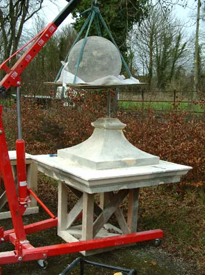 Carefully manoeuvring the finial into position
