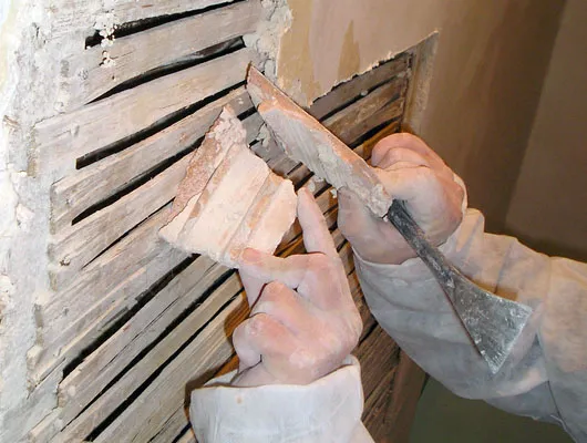 LATHE AND PLASTER: Carefully cutting away of plaster which has lost key
